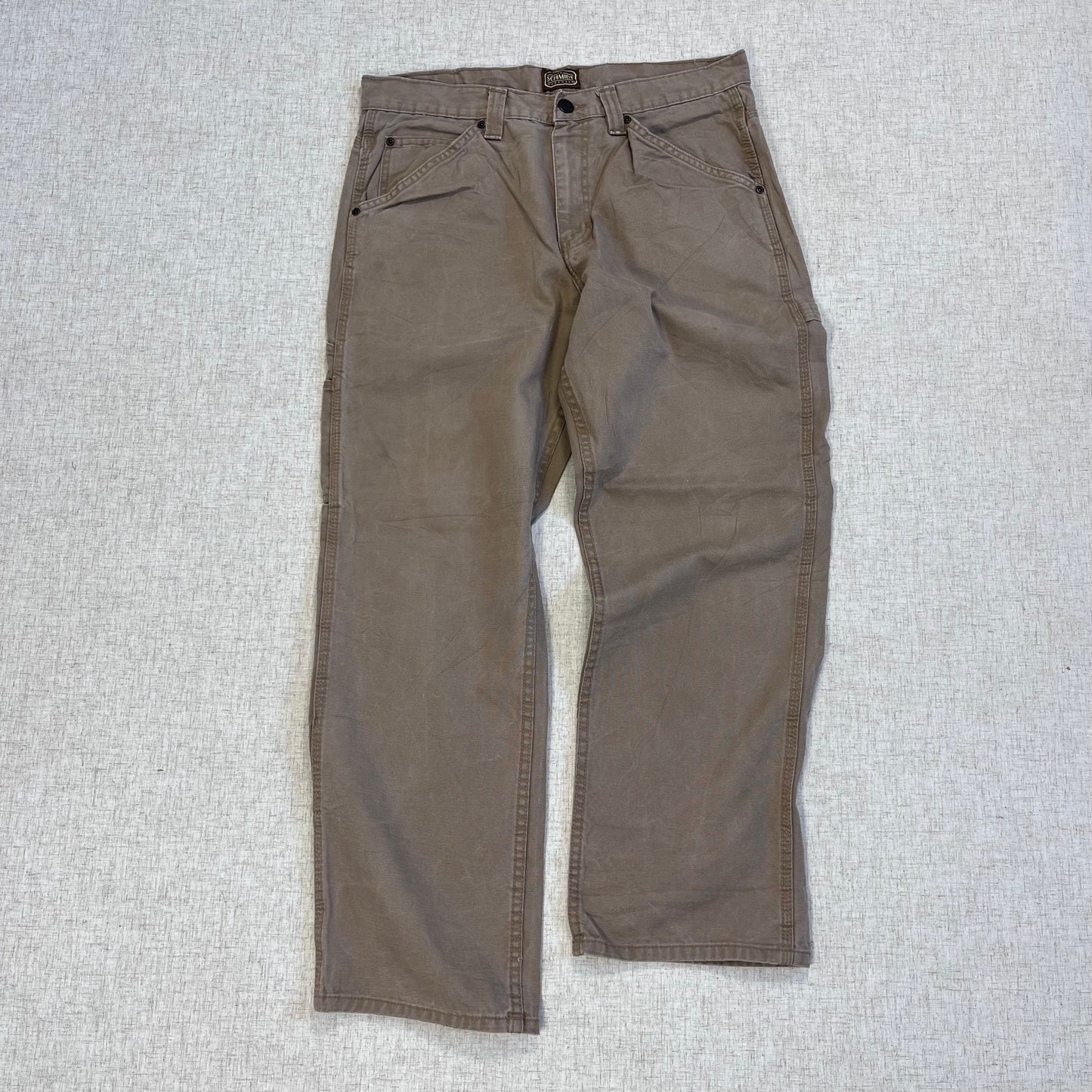 Thrifted – Jean Carpenter Café Claro Schmith Talla 34x30 USA (CL 48) | Cintura 45 cm | Largo 101 cm | Talón 23 cm