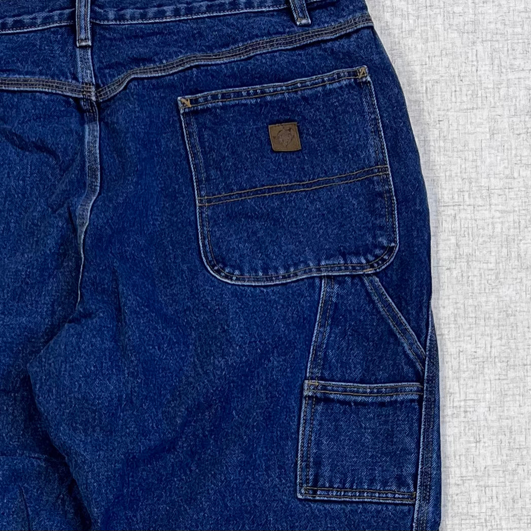 Thrifted – Jean Carpenter Azul Denim Northeast Talla 38x32 USA (CL 52–54) | Cintura 48 cm | Largo 108 cm | Talón 24 cm